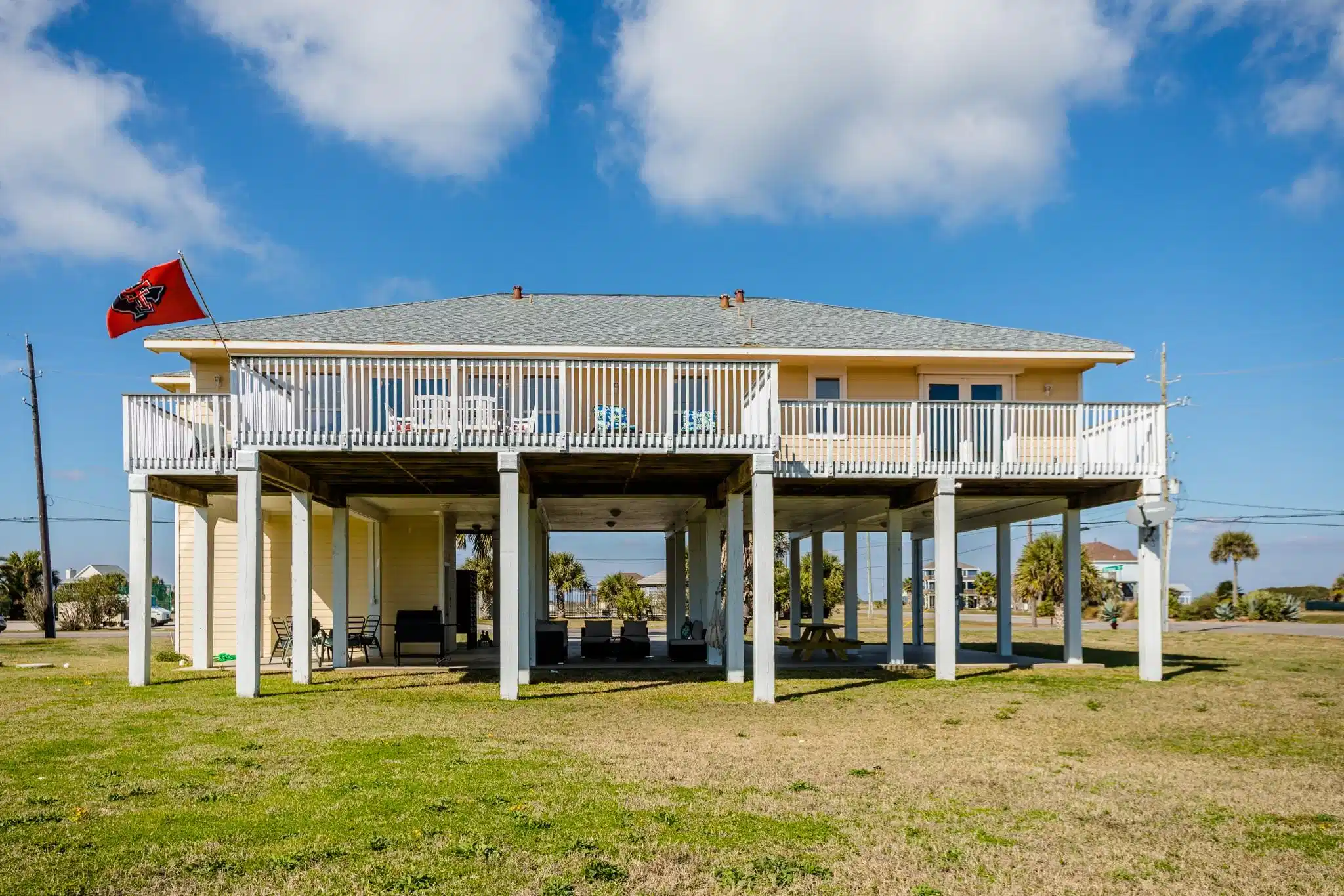 Image 1: Enjoy the beach view from this fabulous deck