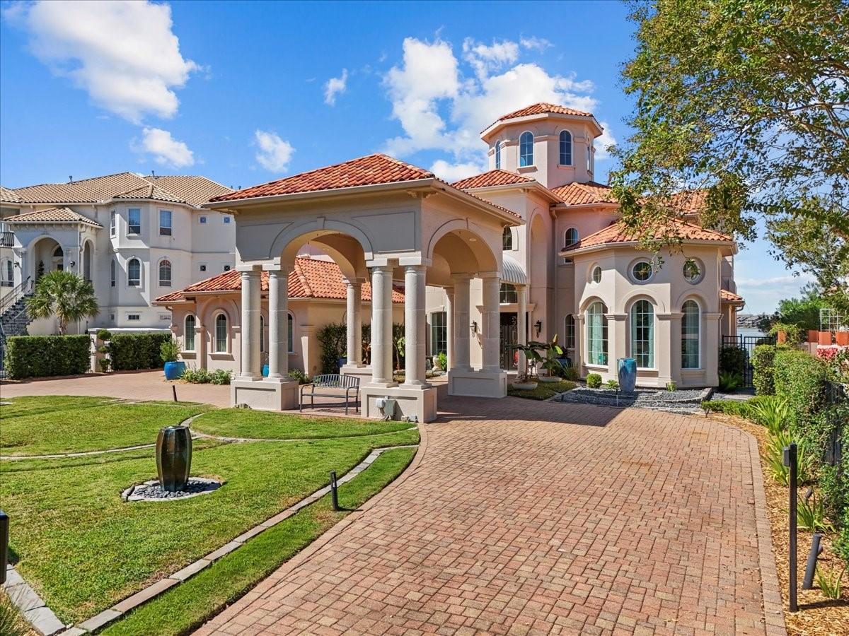 Image 2: Stunning entrance with elegant columns and a welco