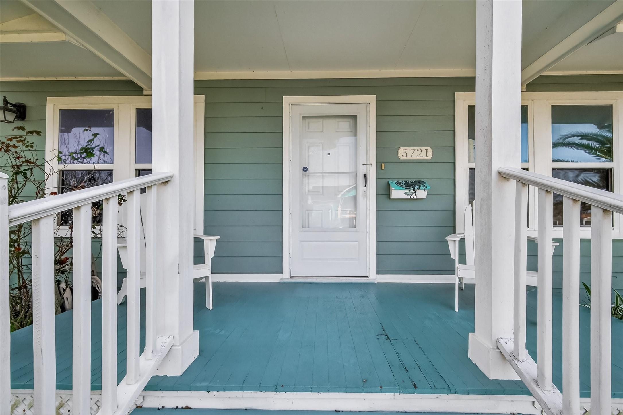 Image 3: A close-up of the inviting covered front porch wit
