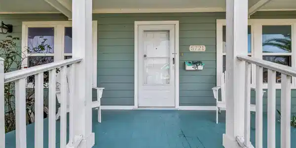 Image 3: A close-up of the inviting covered front porch wit