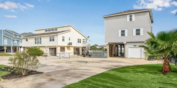 Image 2: This inviting property boasts ample parking and ve