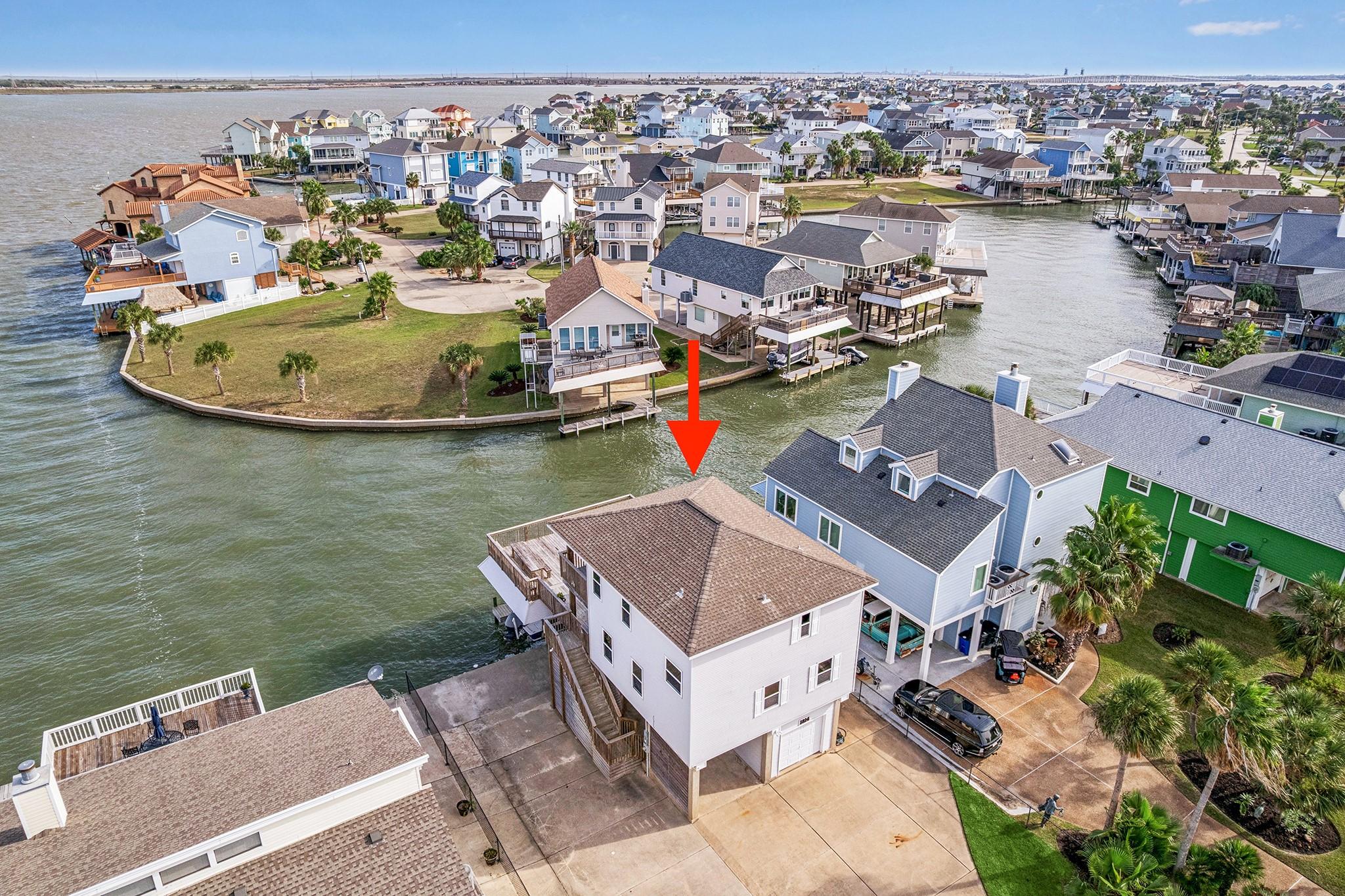 Image 3: Nestled in a vibrant waterfront community, this ho
