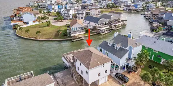 Image 3: Nestled in a vibrant waterfront community, this ho