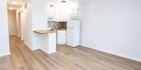 Image 2: Bright and airy kitchen area with modern white cab