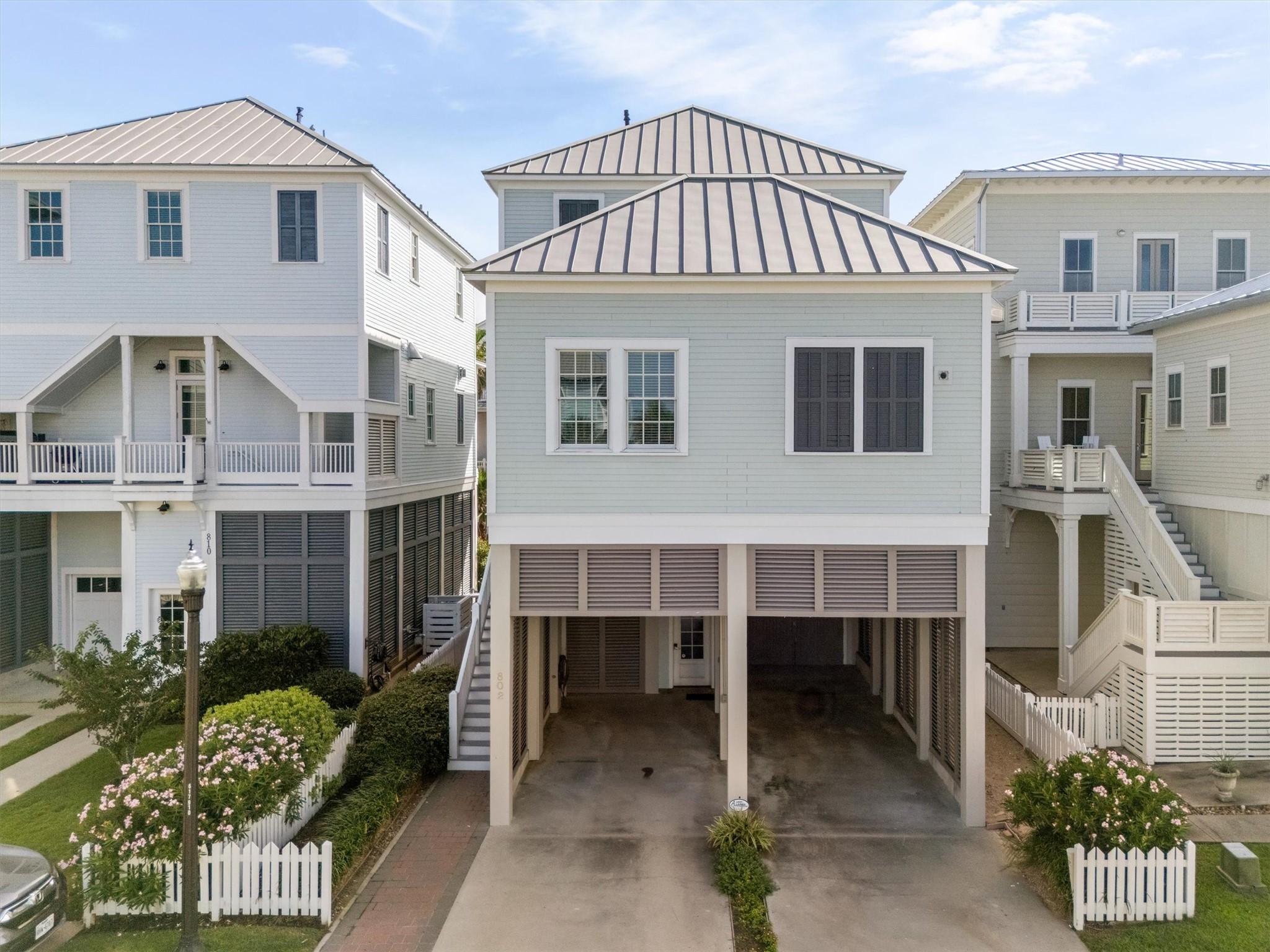 Image 2: This charming home offers ample parking for multip