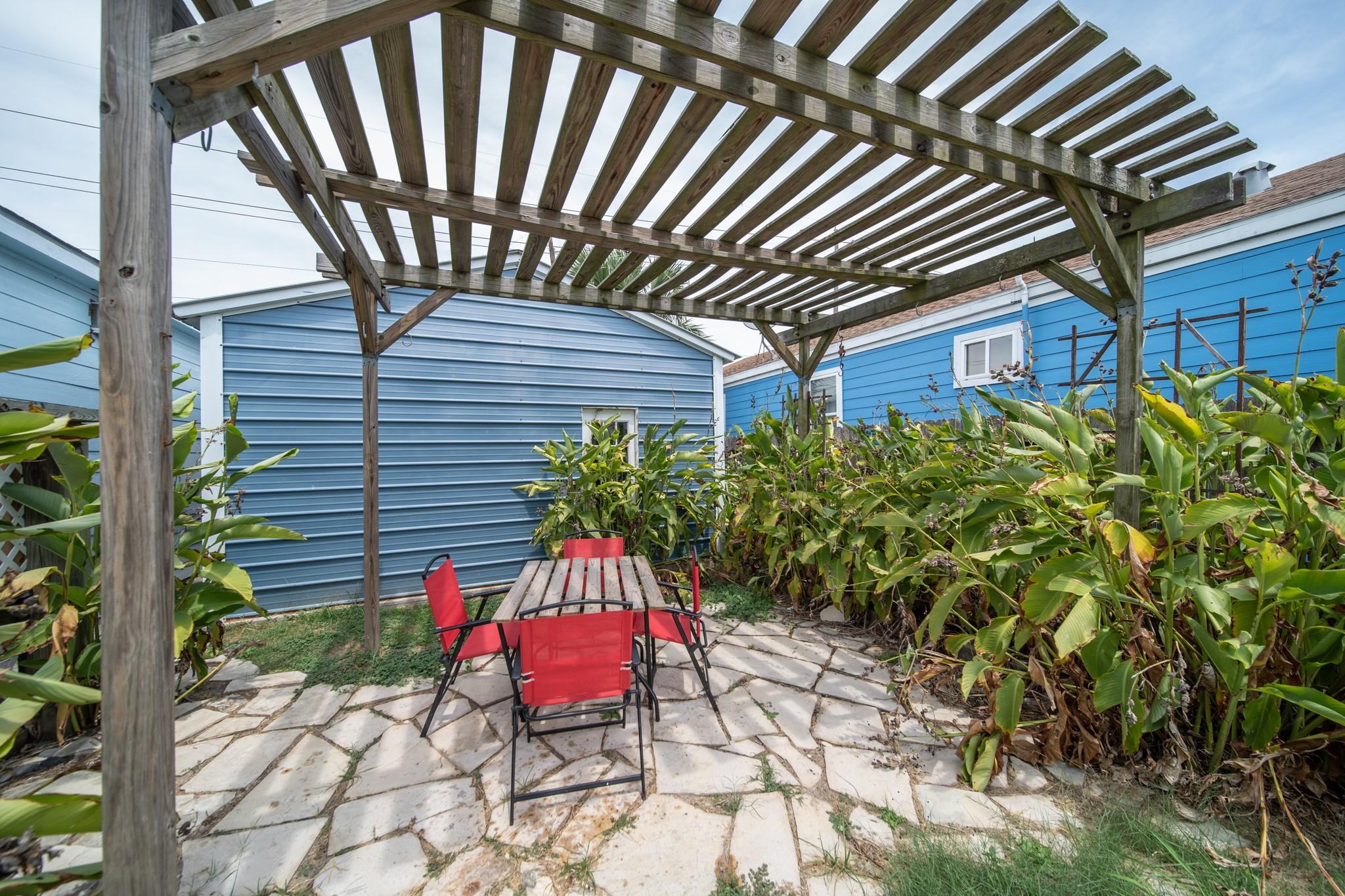 Image 2: A private outdoor seating area under a beautiful w