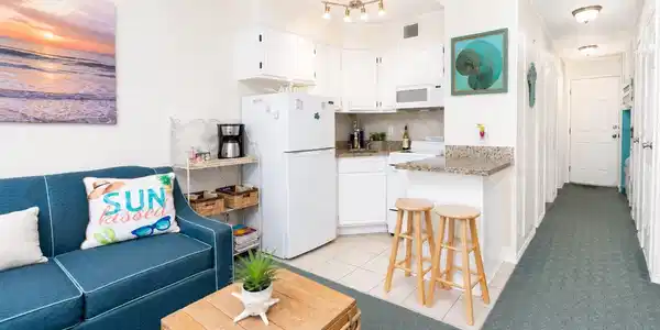Image 3: Charming coastal-themed living space with a cozy b