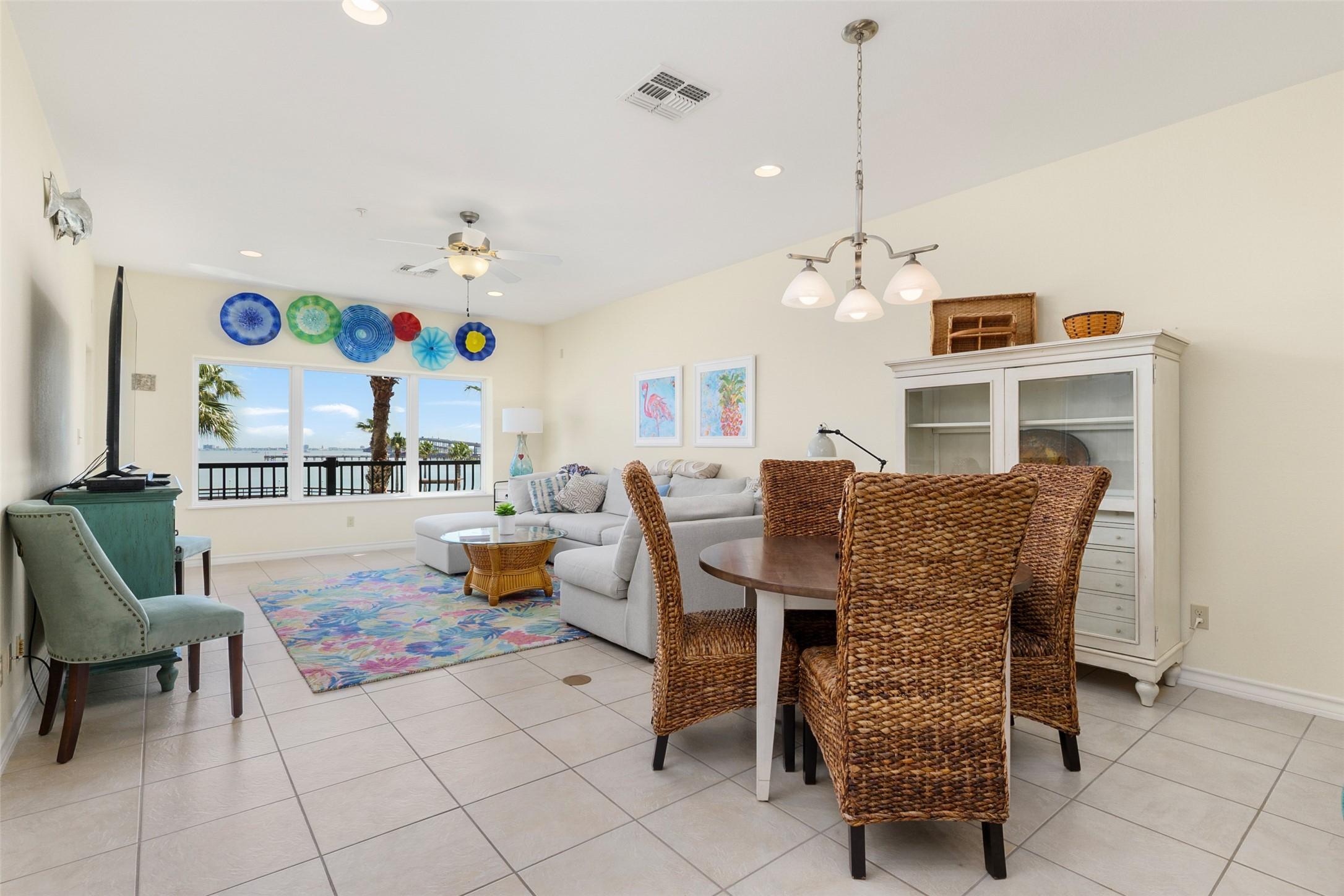 Image 3: Bright and airy living space featuring a cozy seat