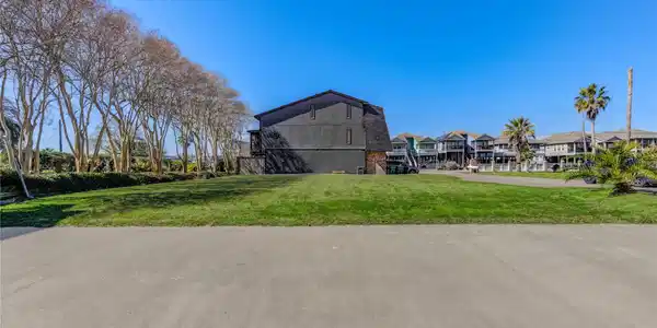Image 4: One side of the property is lined with beautiful,