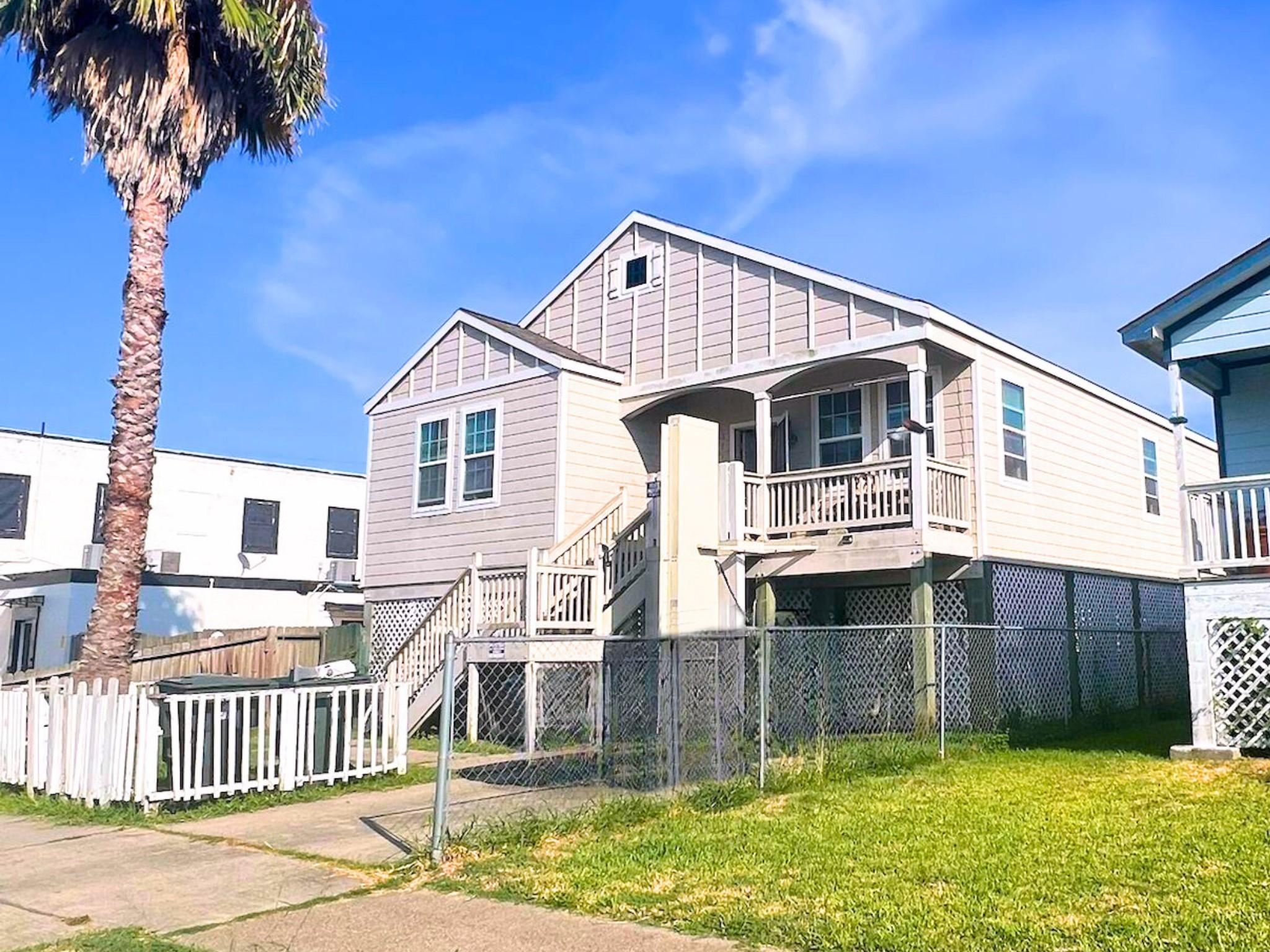 Image 3: Inviting raised home with a balcony-style porch an