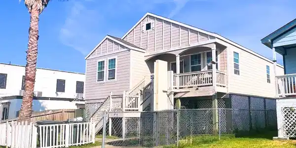 Image 3: Inviting raised home with a balcony-style porch an