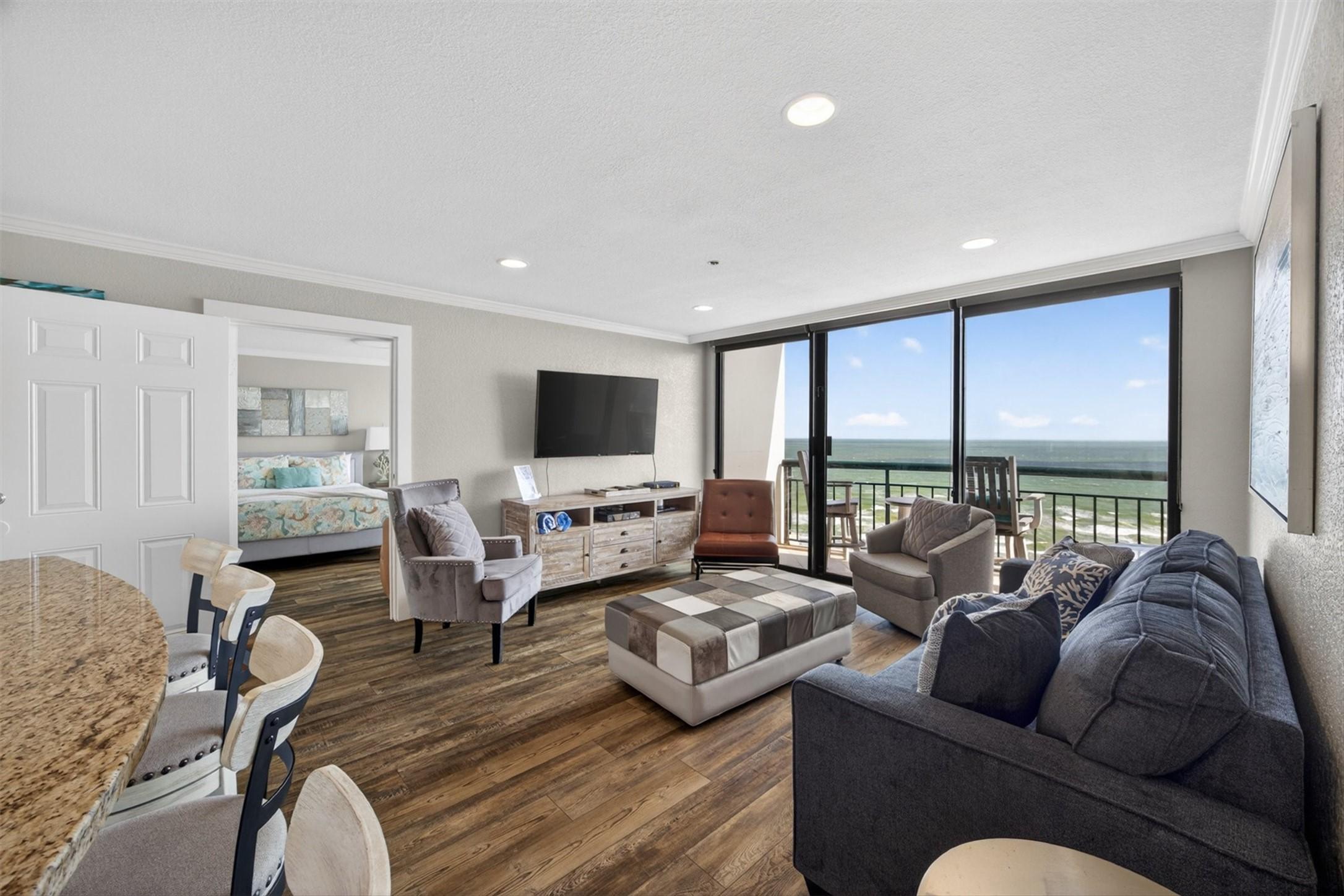 Image 4: Unit 1536 features a bright, open living area with