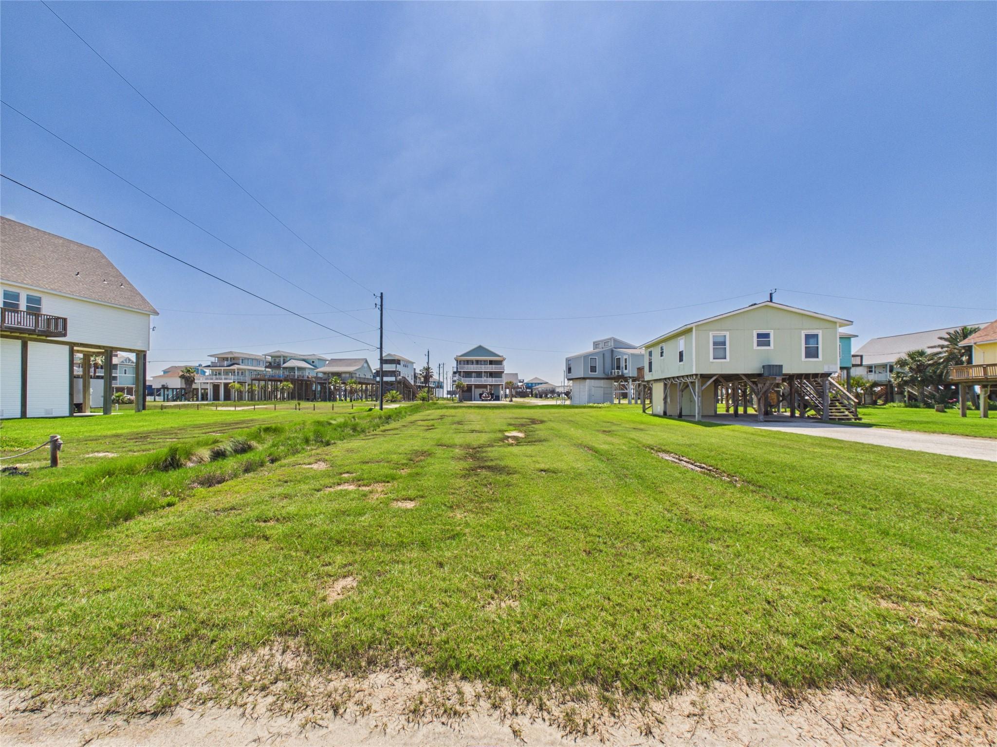 Image 3: The charming neighborhood is populated by golf car