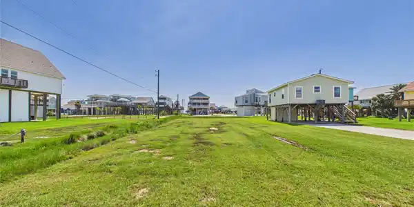 Image 3: The charming neighborhood is populated by golf car