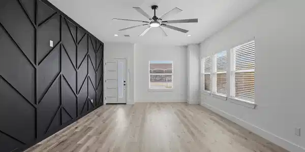 Image 2: Ample living room with plenty of natural light, a