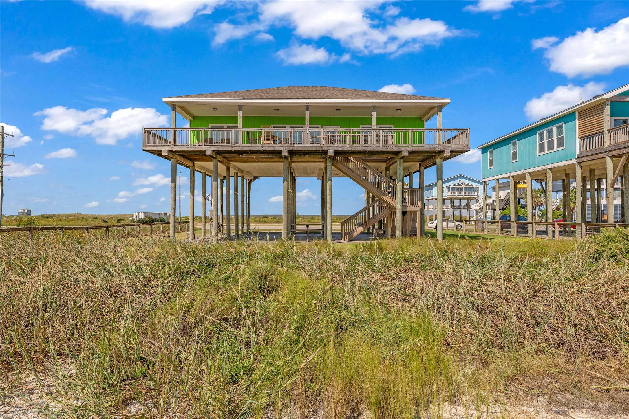 Image 2: Elevated for stunning views, this vibrant, beachsi