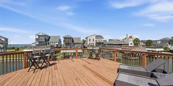 Image 4: Spacious waterfront deck offering the perfect sett