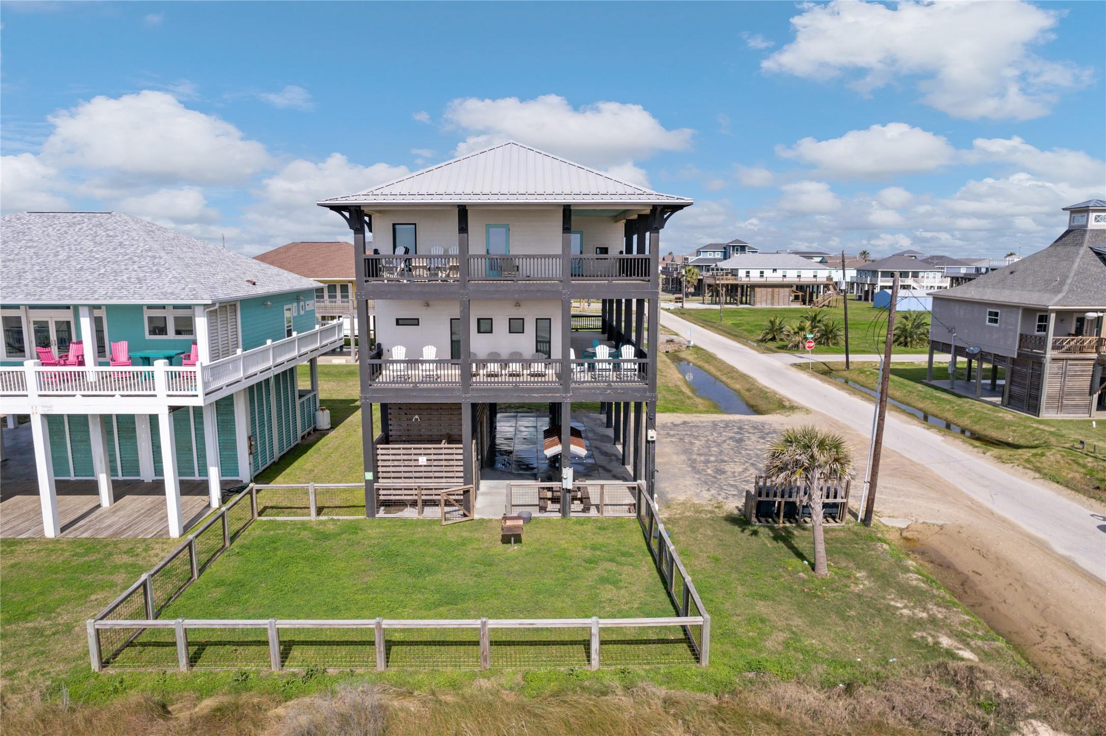 Image 3: Coastal charm, luxury finishes, and wrap-around de