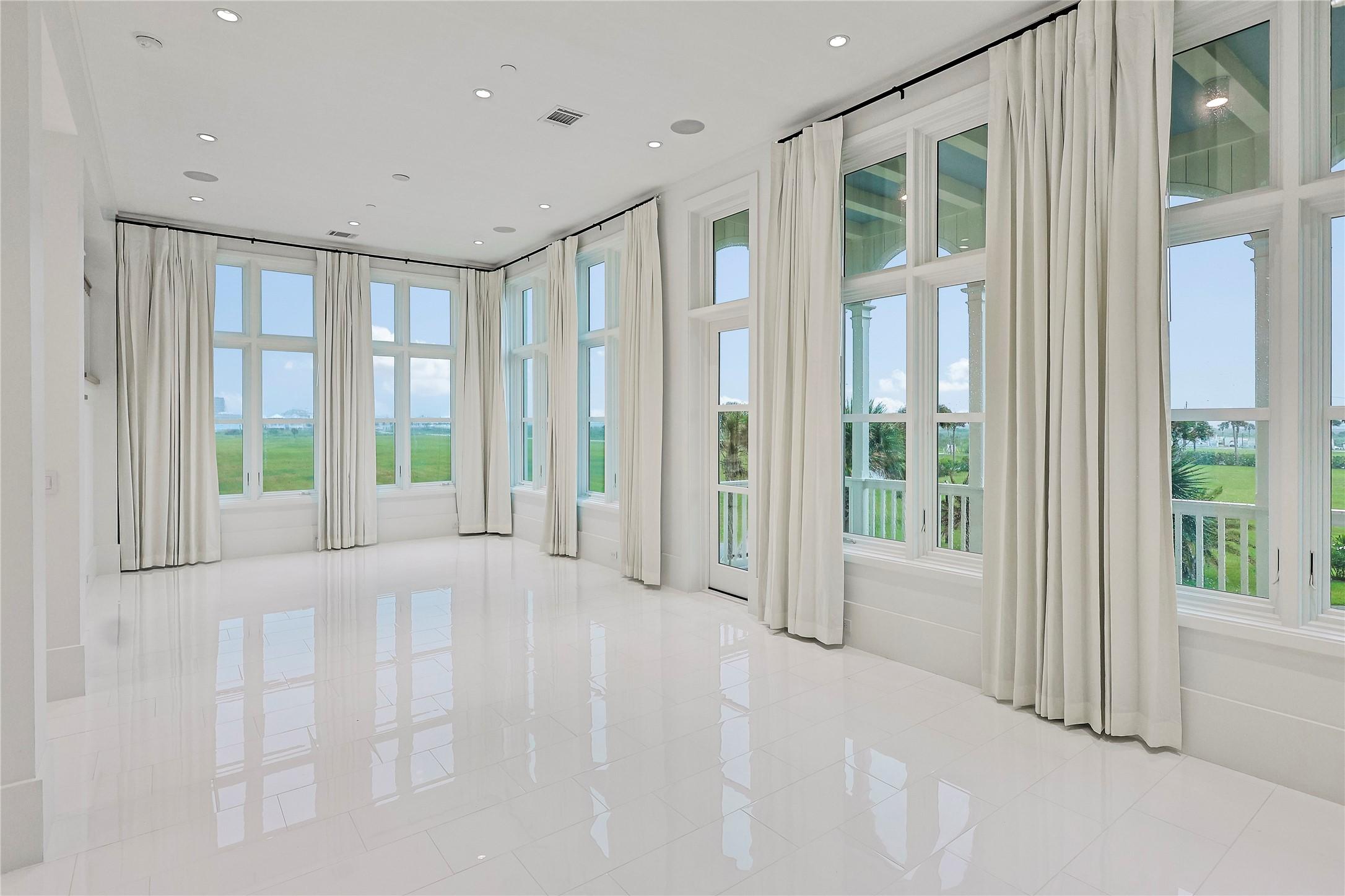 Image 2: The front den offers flexibility as a formal enter