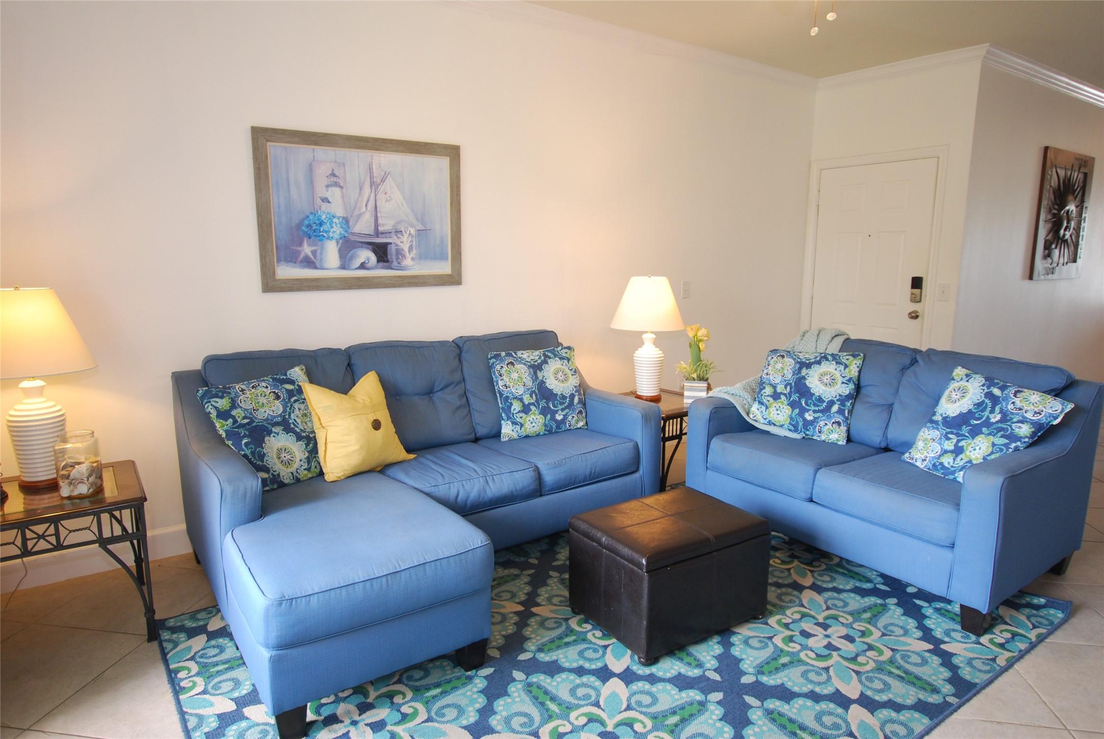 Image 4: Condo has tile floors throughout the living space