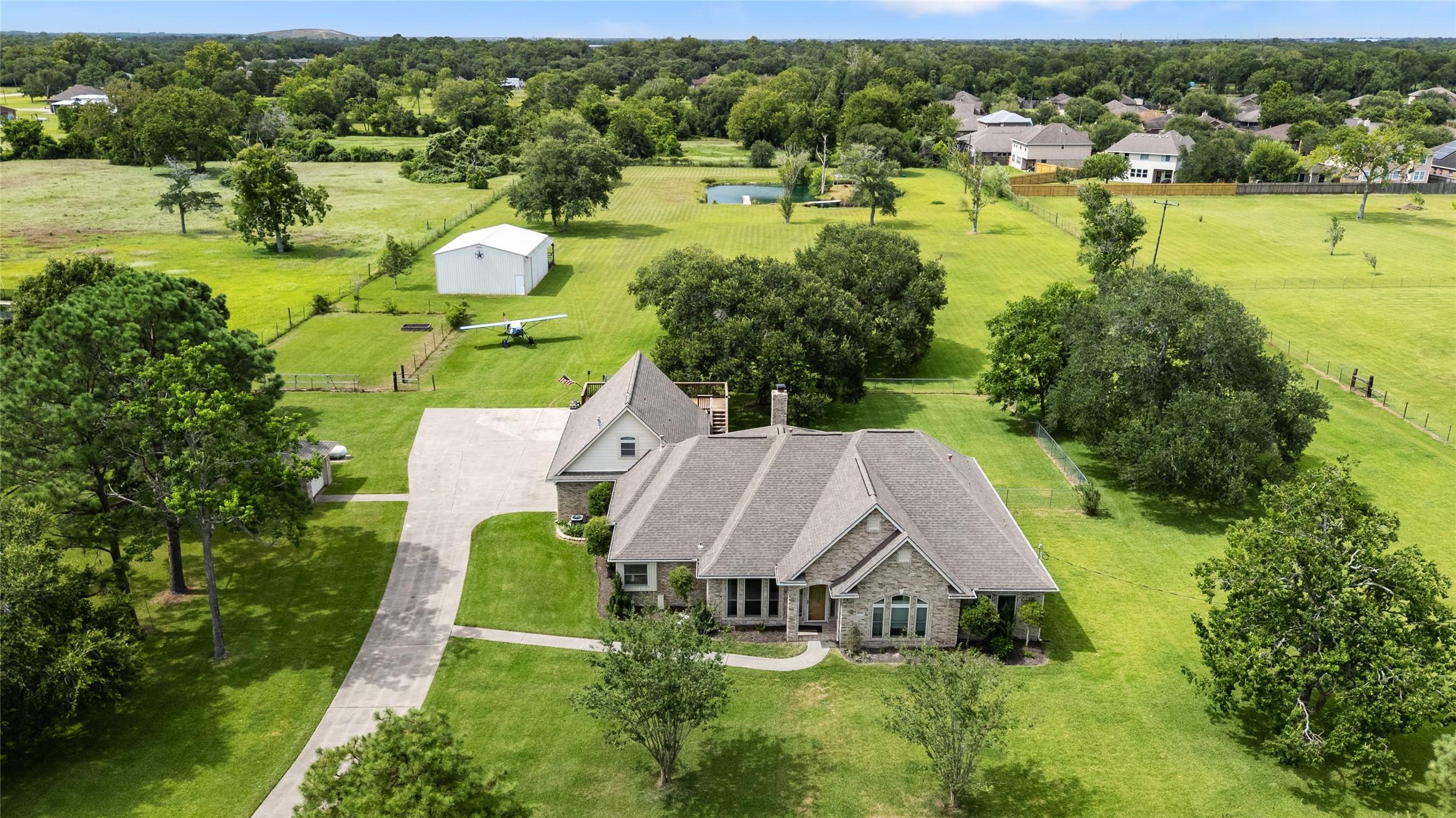 Image 1: Nestled on almost 5 acres, this stunning Santa Fe
