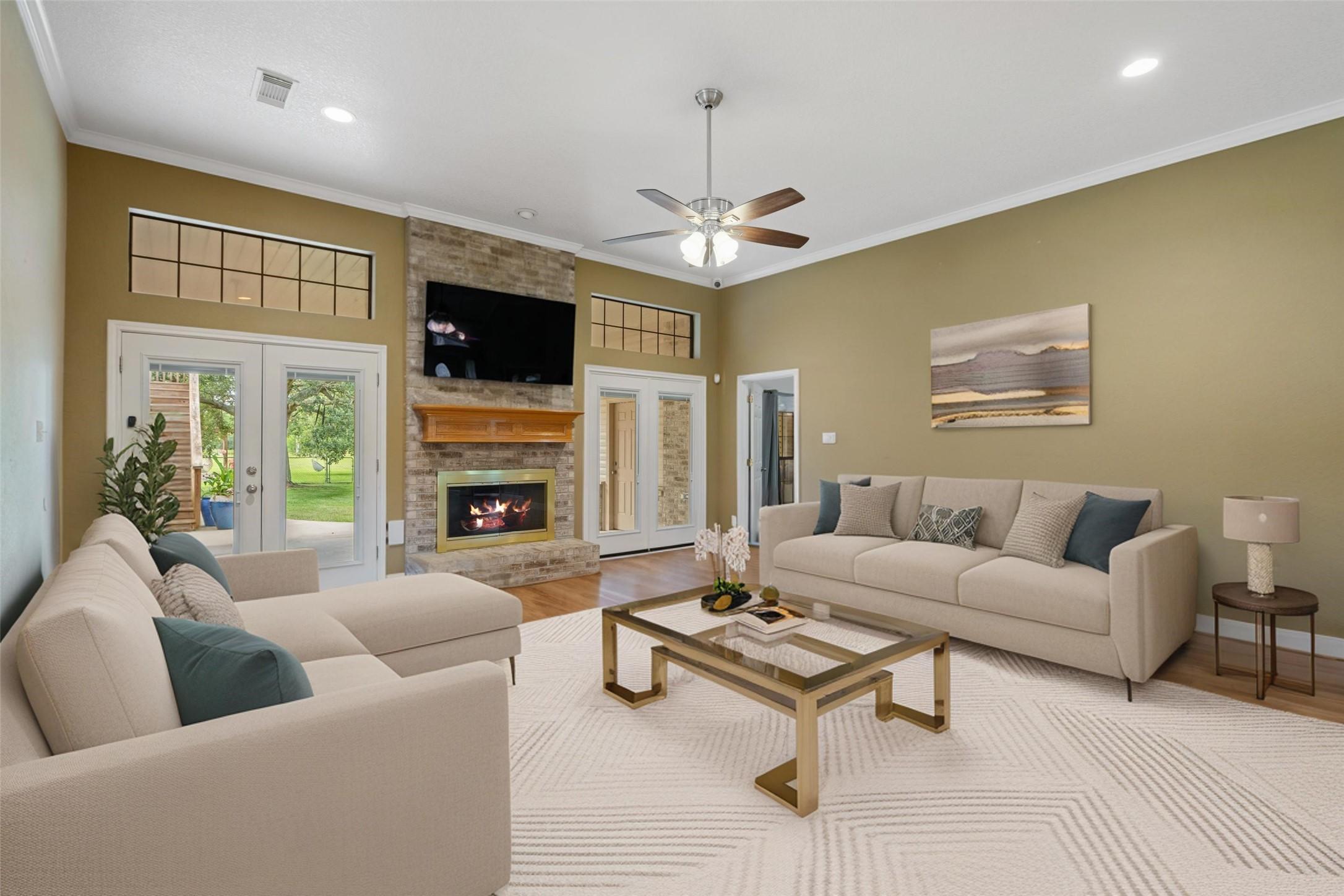 Image 4: Spacious living room featuring a gas fireplace. [v