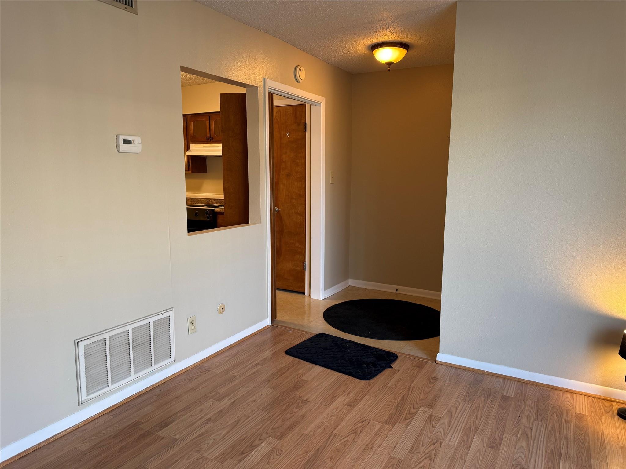 Image 2: Front Door, Entrance to Kitchen, from Livingroom