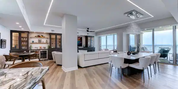 Image 3: Expansive open living and dining areas are framed