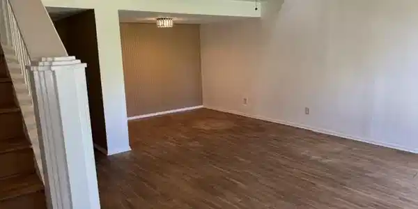 Image 2: As you walk into the home, notice the solid wood f