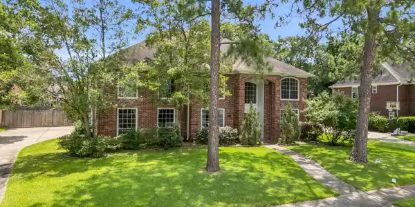 Image 2: Home sits on a large subdivision lot.