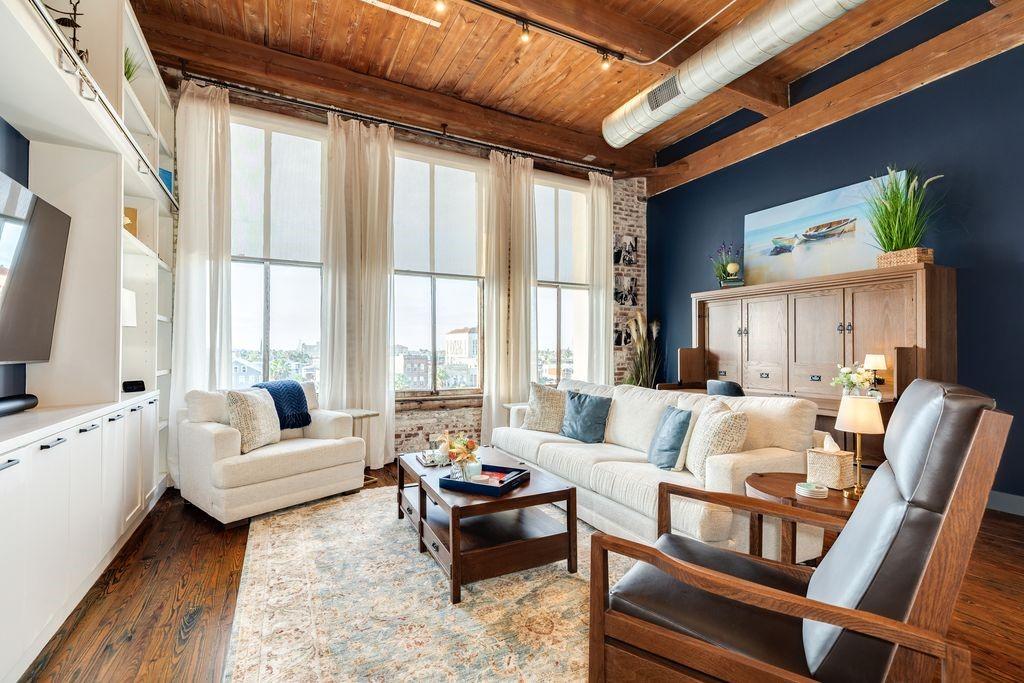 Image 1: Beautiful efficiency with a brick wall and windows