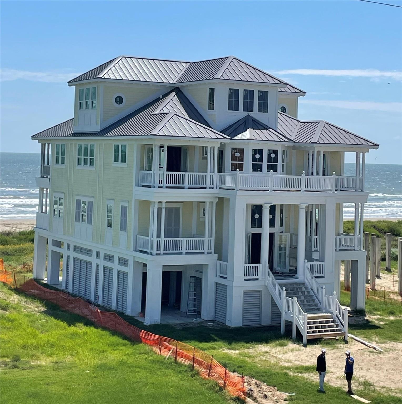 Image 1: Beach front three story property with primary en s