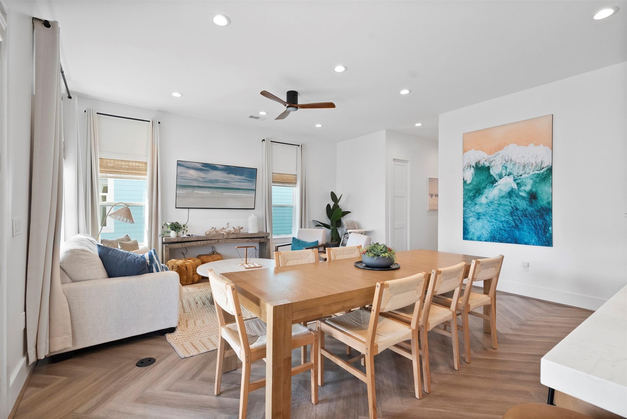 Image 1: This bright, inviting living room perfectly balanc