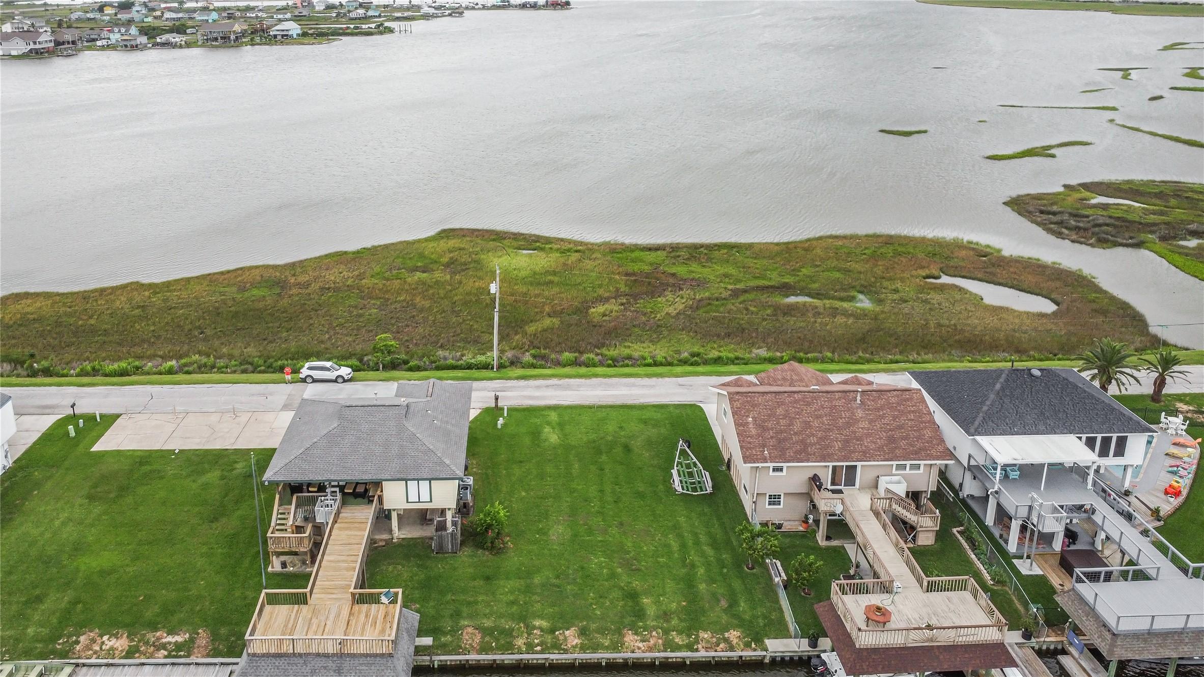 Image 2: Lot is on the right side with a view of the bayou.