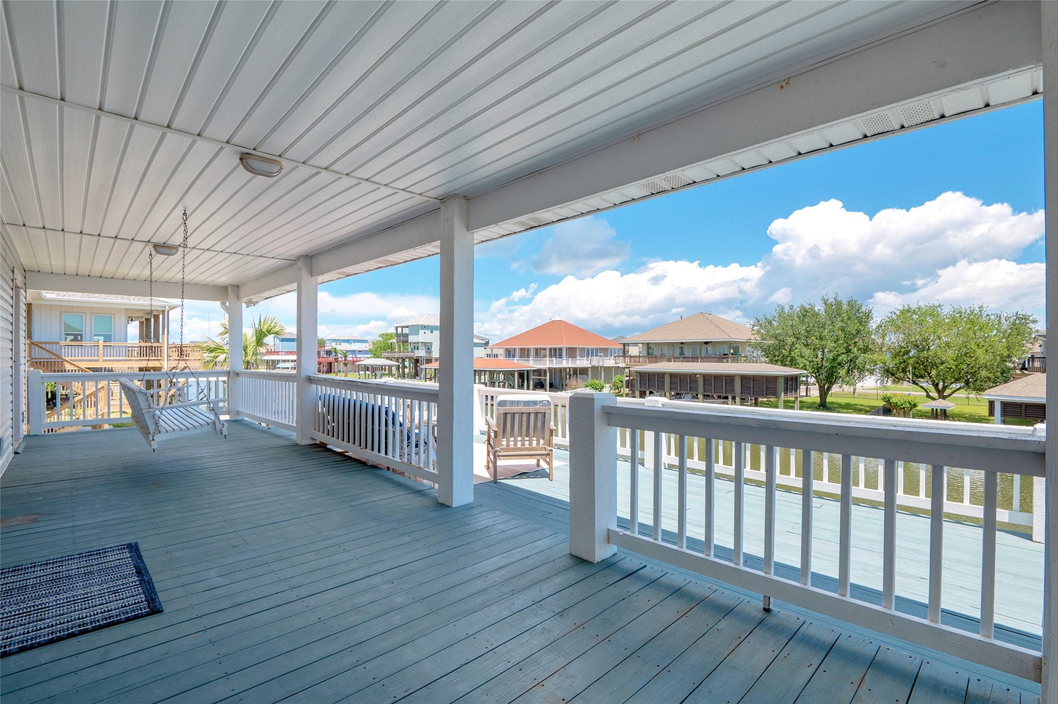 Image 4: Balconies on front and back of the home.  Two swin