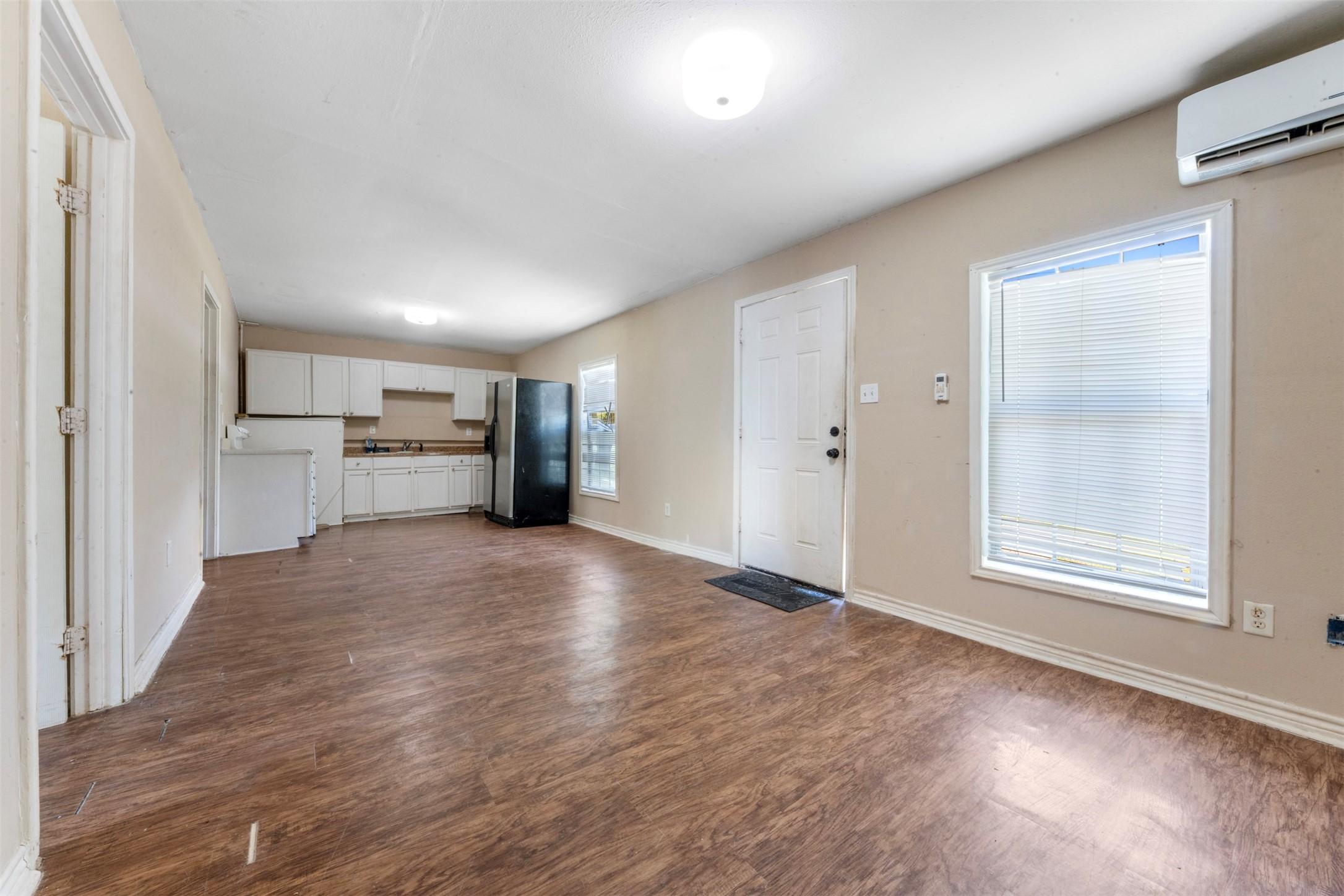 Image 2: View of kitchen from the living area.