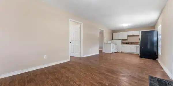 Image 3: view of kitchen from the living area.