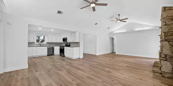 Image 2: New flooring, fresh paint, and new ceiling fans.