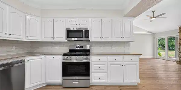 Image 4: Kitchen opens to Dining room and Living room.