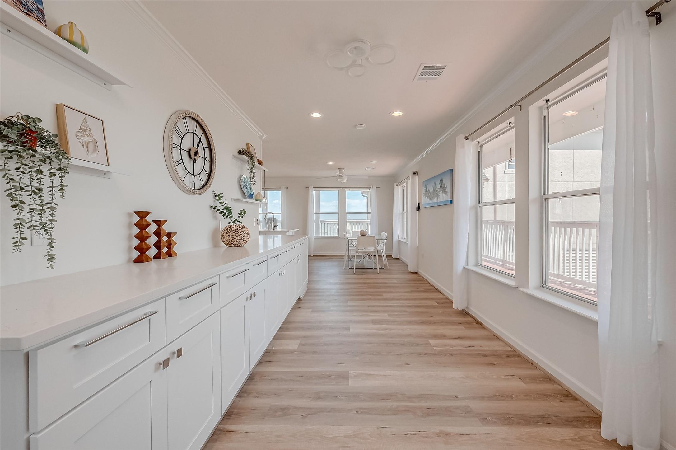 Image 2: Bright, open-concept living space featuring abunda