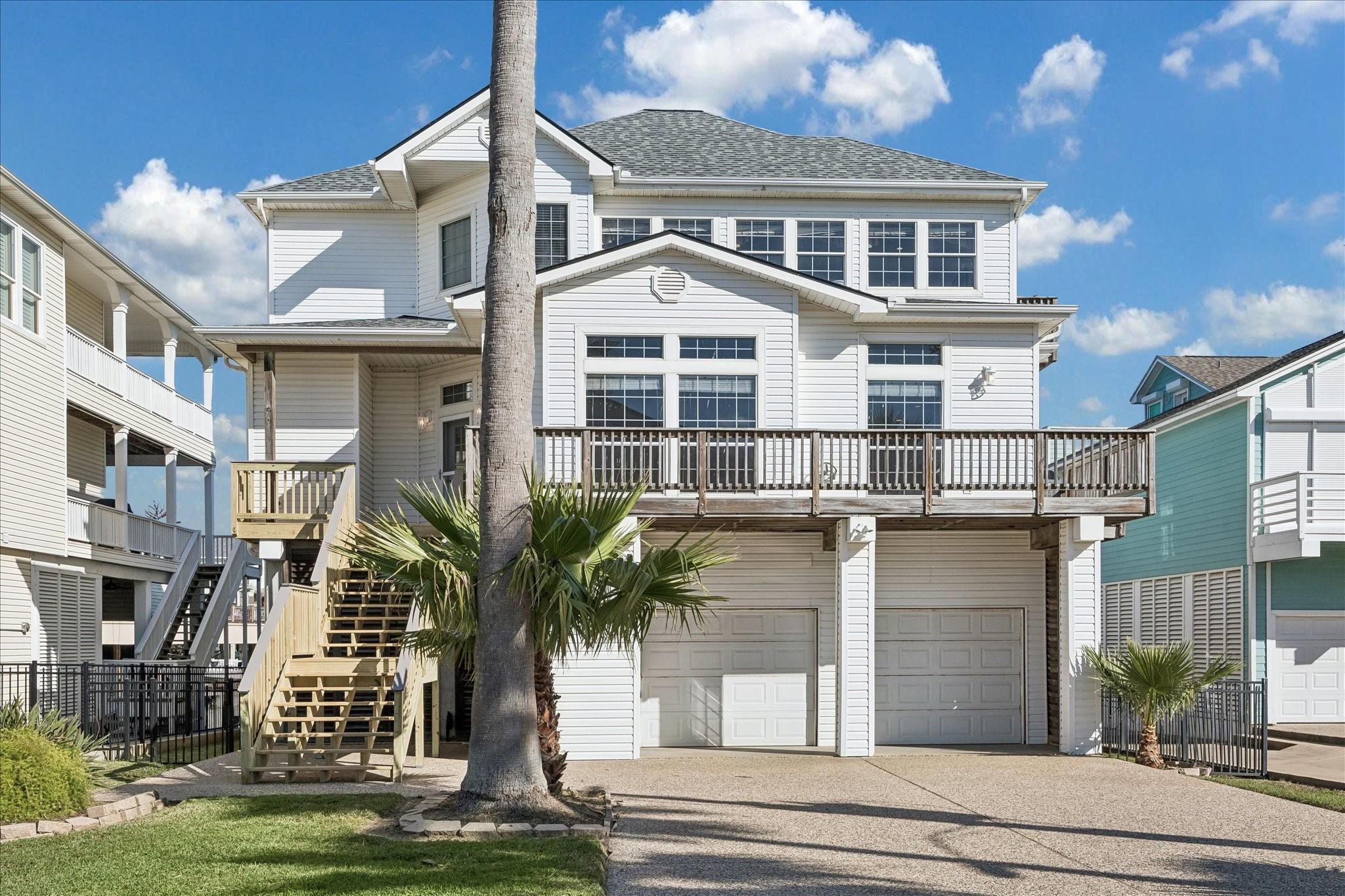 Image 1: This is a charming, multi-story coastal home with