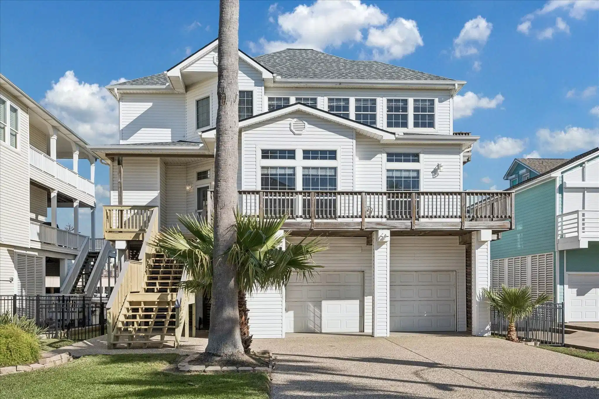 Image 1: This is a charming, multi-story coastal home with