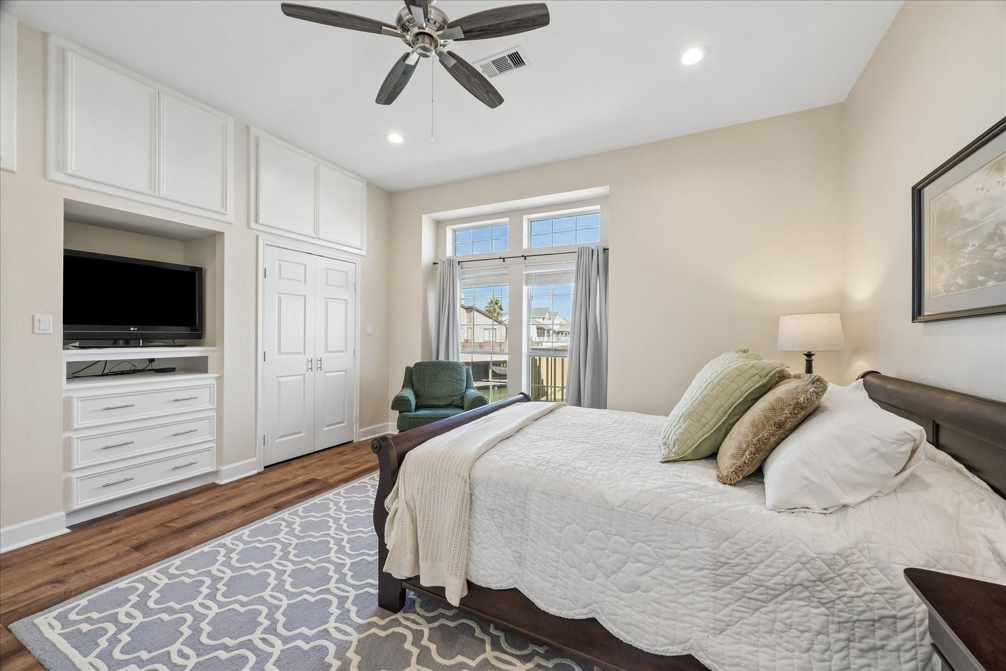 Image 4: This cozy bedroom features a large window for natu