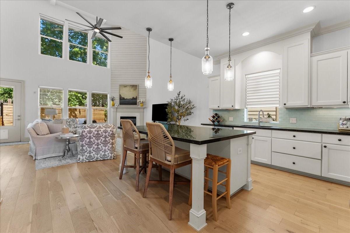 Image 4: Light-filled open concept living with soaring ceil