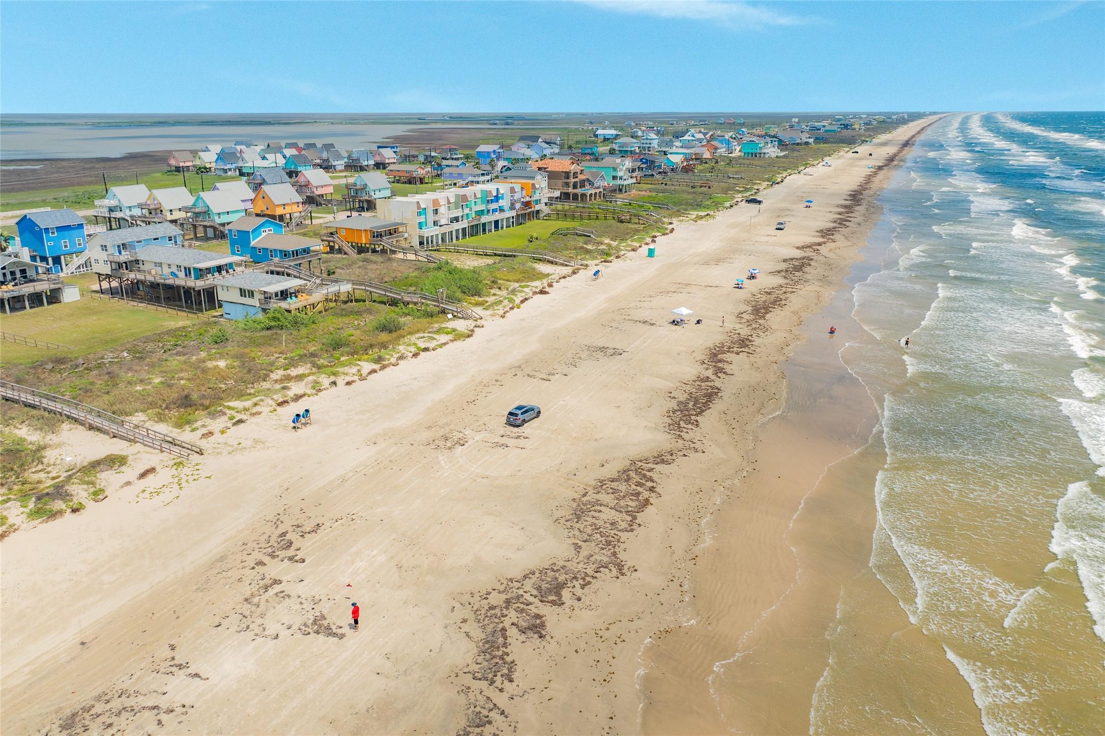 Image 3: Sweeping aerial captures the beautiful coastline a