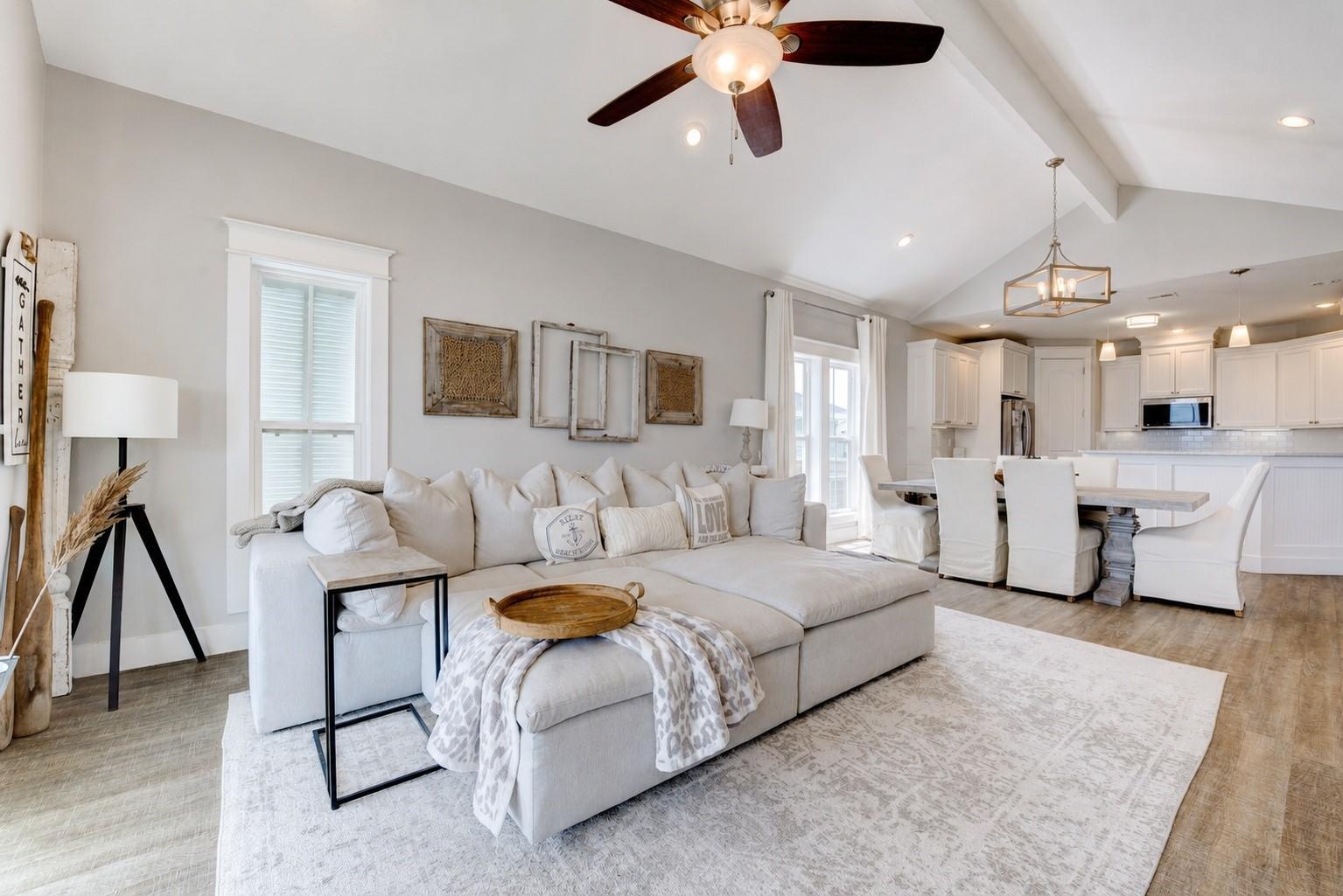 Image 3: Main living area: vaulted ceiling, open to kitchen