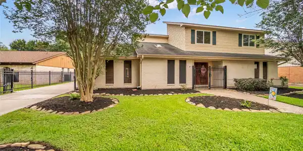 Image 3: Welcome Home! Beautiful landscaping, mature trees,