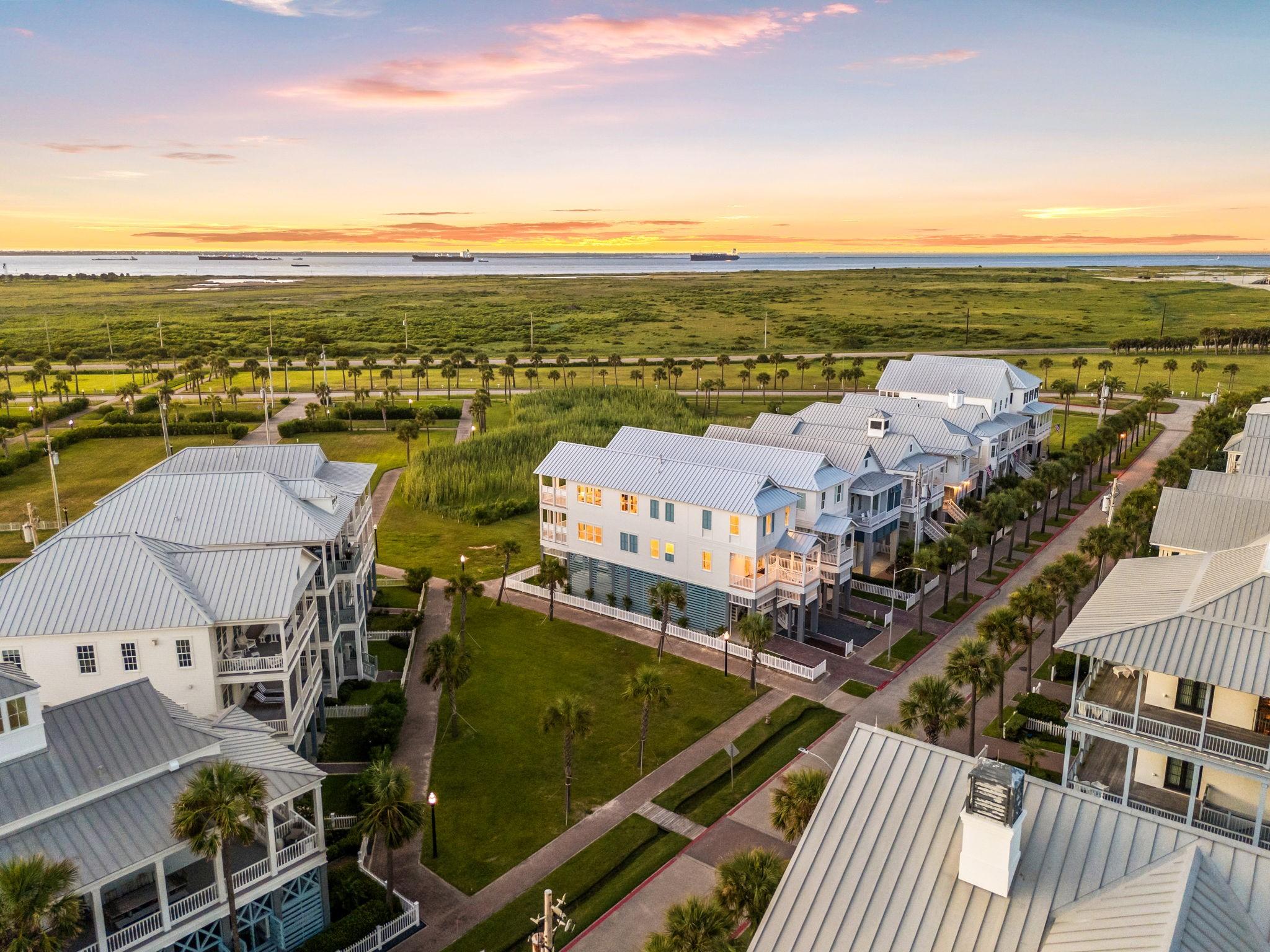 Image 3: Enjoy amazing bay views from the rear porches. Hom