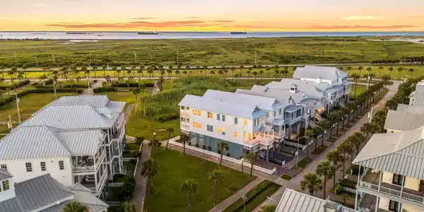 Image 3: Enjoy amazing bay views from the rear porches. Hom