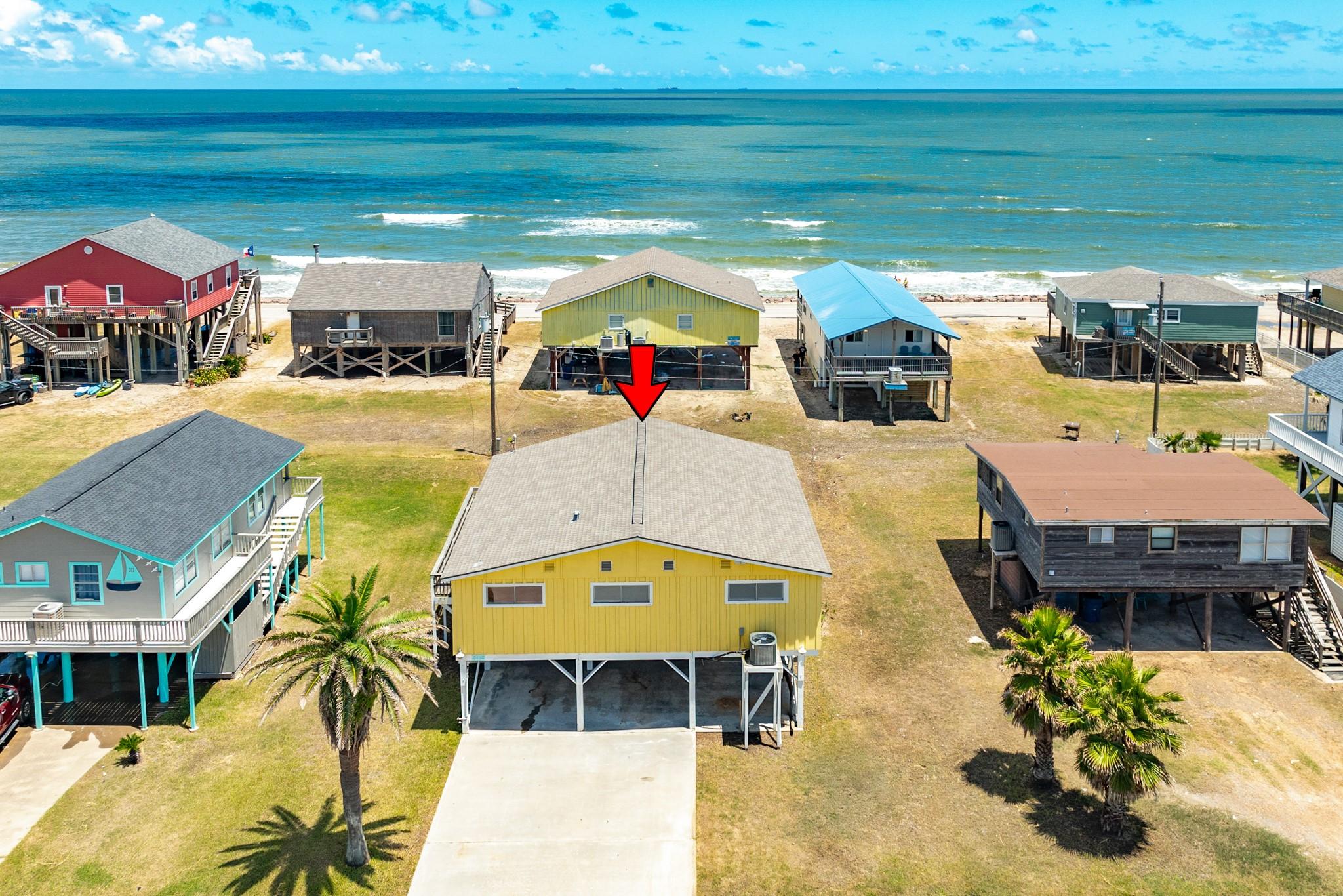 Image 4: Aerial Front View &ndash; Elevated coastal home just ste